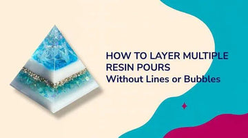 Pyramid-shaped layered resin art with blue, white, and gold colors illustrating how to layer multiple resin pours without lines or bubbles