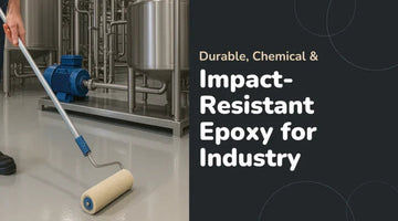 Person applying impact-resistant epoxy coating on an industrial floor near metal machinery