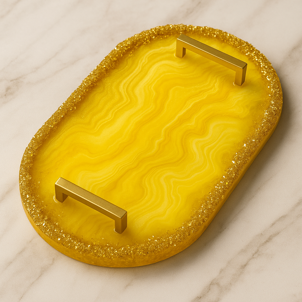 Yellow decorative tray with gold glittery edge and handles on a marble surface